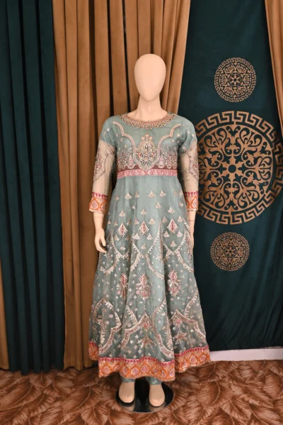 Elegant Organza Maxi with intricate heavy embroidery, paired with flapper trousers and a delicate net dupatta, perfect for traditional Pakistani and Indian wear, ideal for weddings and festive occasions.