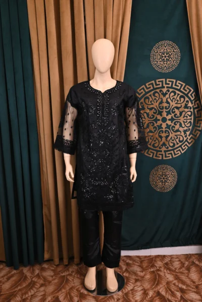 Handmade traditional wear featuring heavy floral embroidery on net and cambric fabric, showcasing elegant Pakistani and Indian design with intricate craftsmanship.