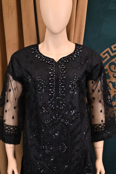 Handmade traditional wear featuring heavy floral embroidery on net and cambric fabric, showcasing elegant Pakistani and Indian design with intricate craftsmanship.