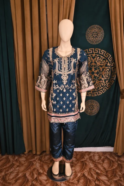 Traditional Pakistani and Indian wear featuring heavy floral embroidery on luxurious organza and silk capri fabric, handcrafted for a sophisticated and elegant look.