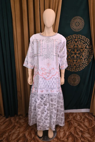 Elegant traditional wear featuring intricate floral embroidery on luxurious organza fabric. Handmade with rich craftsmanship, ideal for special occasions and cultural celebrations