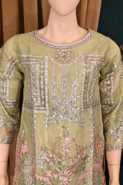 Elegant traditional wear featuring intricate floral embroidery on luxurious organza fabric. Handmade with rich craftsmanship, ideal for special occasions and cultural celebrations.